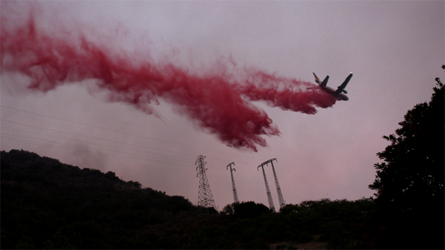 Air tanker dropping fire retardant in California. Credit: Tim Walton